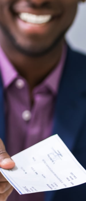 Check processing services by Total Merchant Services with man holding a check.