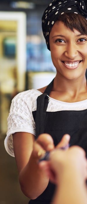 Free Retail Terminal by Total Merchant Services featuring woman holding retail credit card reader.
