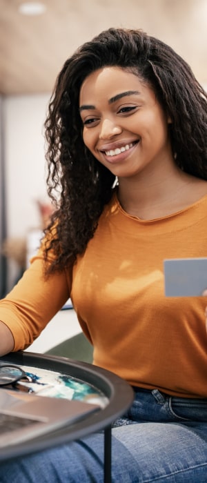 Gift Card Processing Services by Total Merchant Services featuring a kid holding a gift card.